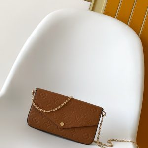 p500M83025 Blue M15968 Print M14193 Chocolate Brown M14227 Purple-Gray M83589 New Blue M27048 Pearl Blue M69977 Gray M80428 Black M82047 Cream White M81759 Pink M82349 Blue M82480 Green M64064 Black M82363 Cream White M68697 Apricot M67856 Pink M64099 Blue M63700 Bright Red M81531 Earth Yellow This Pochette Félicie chain bag features Monogram Empreinte leather embossed with the Monogram pattern. Its envelope-style shape includes a removable inner pouch.Attach the chain to effortlessly switch between clutch and shoulder bag styles.21.0 x 12.0 x 3.0 cm (L x H x W) • Monogram Empreinte embossed soft grained calf leather • Fabric lining • Metal hardware • Snap closure • Large compartment • Interior patch pocket • Detachable zippered pouch • Detachable patch pocket with card slots • Chain: Detachable • Chain drop: 173 cm